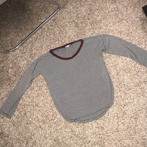 Black and white striped shirt with maroon neck